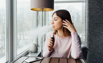 Woman Vaping Life Insurance